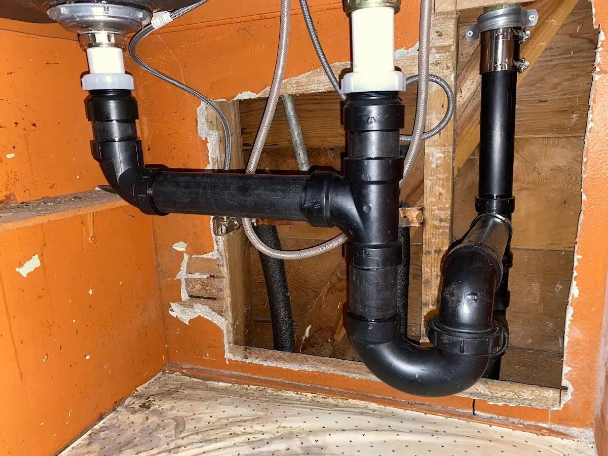 Professional Garbage Disposal Repair equipment and tools on the job in Gilberts